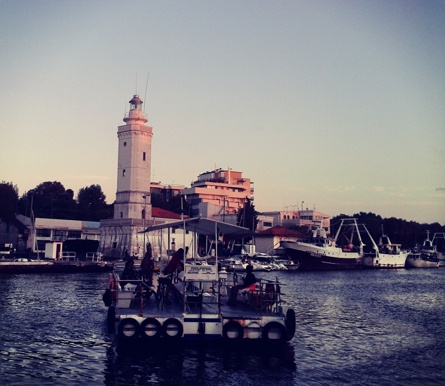 Rimini's lighthouse and ferry across the port canal